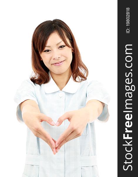 Young Asian Female Nurse Shows Fingers Heart Free Stock Images