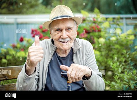 Portrait Of A Smiling And Confident Senior 87 Years Old Cute In A Hat