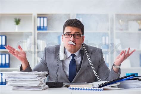 Businessman Smoking In Office At Work Stock Image Colourbox