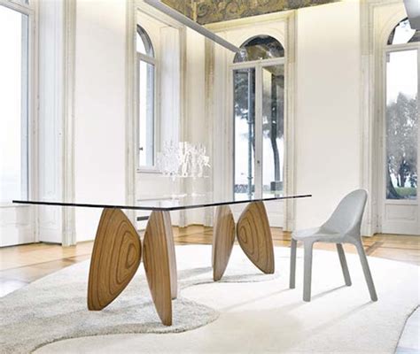 Glass top dining table with wooden base. glass wood dining table combination - Iroonie.com