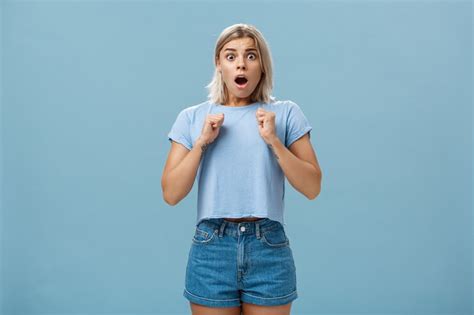Premium Photo Stunned Shocked Girl Standing In Stupor With Dropped