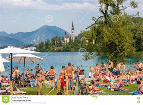 People Enjoying The Summer At The Beach Lake In Slovenia