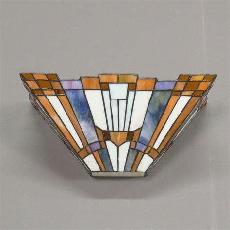 The light is usually, but not always, directed upwards and outwards, rather than down. Wall sconce Tiffany art deco - Chandeliers