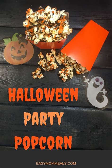 Halloween Party Popcorn With Jack O Lantern And Ghost Cutouts On