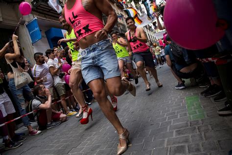 men run in stilettos for madrid gay pride race