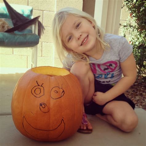 A Joyful Girl Pumpkin Carving