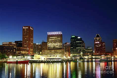 City Lights Reflected In Baltimore Inner Harbor At Twilight Photograph