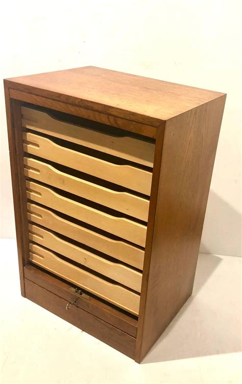 Select a filing cabinet with features like locking drawers for increased security or casters for mobility. Danish Modern Tambour Door File Cabinet with Multi Drawer ...