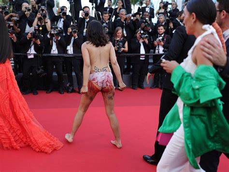 Nude Protester Interrupts Red Carpet At Cannes Film Festival Upsmag