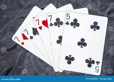 Five Playing Card S A Hand Of A Four Of A Kind Seven S And A Five Stock