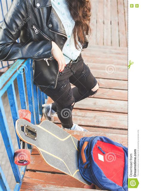 Hipster Skateboarder Girl With Skateboard Standing Outdoor Stock Image