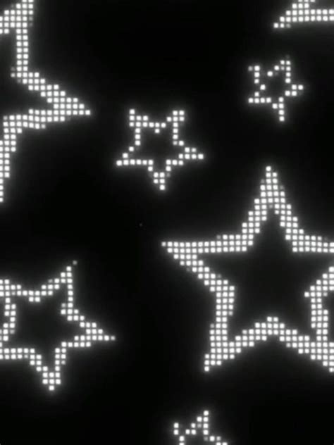 An Array Of Pixelated Stars On A Black Background