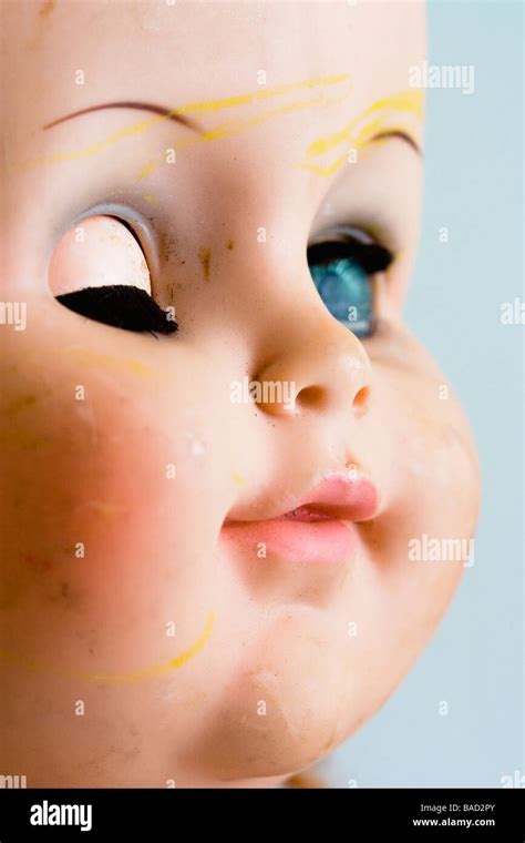 A Well Used Baby Doll Face With One Eye Closed Stock Photo Alamy