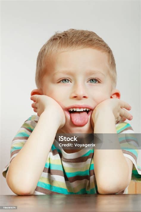 Kid Making Funny Faces Being Bored Stock Photo Download Image Now