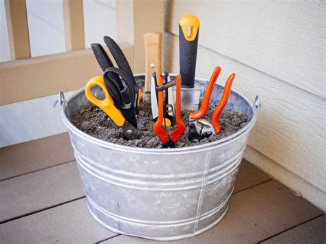 Store Gardening Tools In A Bucket Filled With Sand And Oil