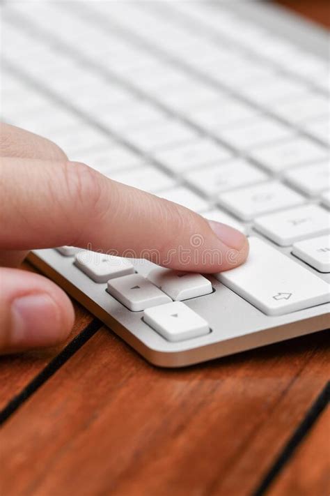 A Person Clicking Button On Computer Keyboard Stock Photo Image Of