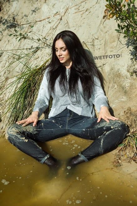Shop 78 top overalls levis and earn cash back all in one place. Brunette Girl in Wet and Dirty Levis Jeans Has Fun by the Lake - Wetlook.one