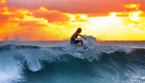 Man Surfing A Wave At Sunset Image Free Stock Photo Public Domain