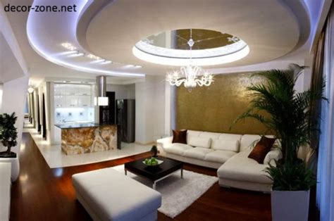 Ceilings that are not so attached to the roof instead of carved out popping like beauty are a trend this helps in making a clear demarcation, without having to build walls in between. false ceiling designs for living room : photos, structure ...
