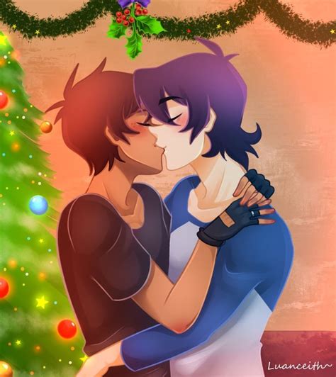 Two People Are Hugging In Front Of A Christmas Tree