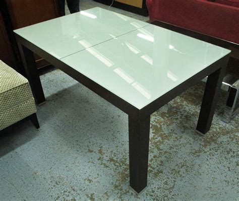 Imbue your dining room with clean, modern style by adding this thao glass dining table from casabianca home. DINING TABLE, rectangular, extending with central darkwood ...