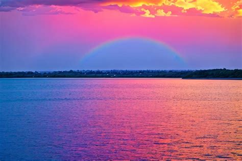 Premium Ai Image Rainbow Colorful Sunset On Blue Pink Sky Yellow