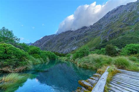 Wooden Bridge Over River In The Mountains Fiordland New Zealand 9