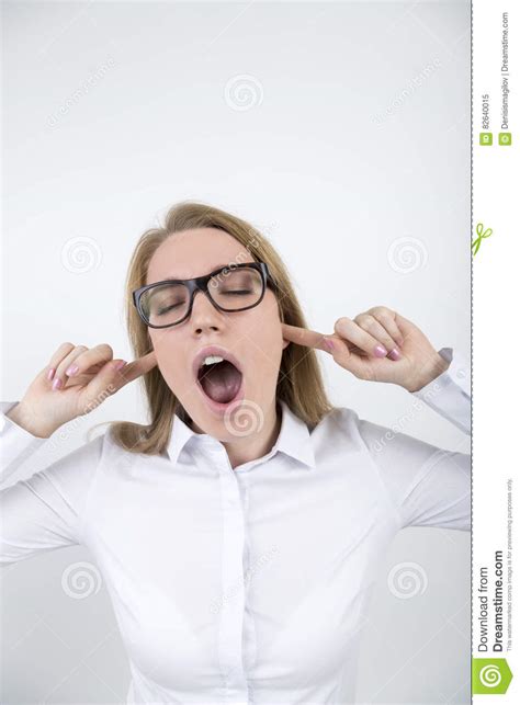 blond girl in glasses with fingers in ears stock image image of background female 82640015