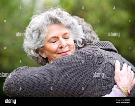 They Treasure Each Other Shot Of A Senior Woman Lovingly Embracing Her