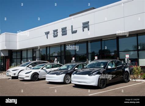 Maplewood Minnesota Tesla Car Dealership Cars At Charging Stations