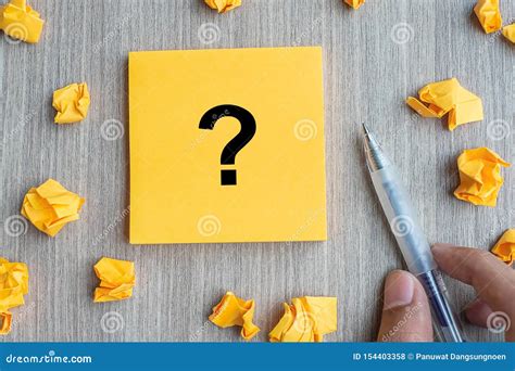 Paper Businessman S Head Outline With Question Marks On Table Stock