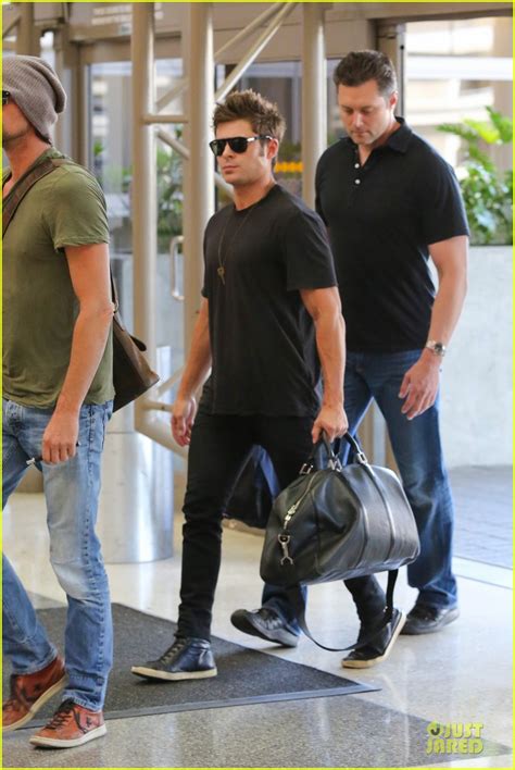 Zac Efron Checks In His Muscles At Lax Airport Photo 3096947 Zac