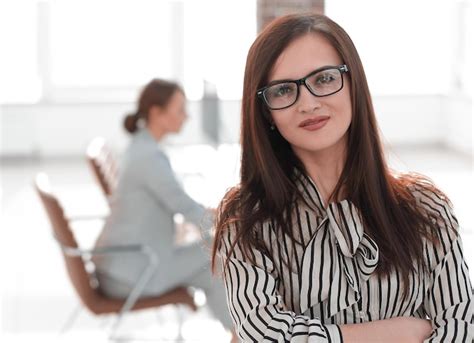 Premium Photo Successful Business Woman On Blurred Office Background