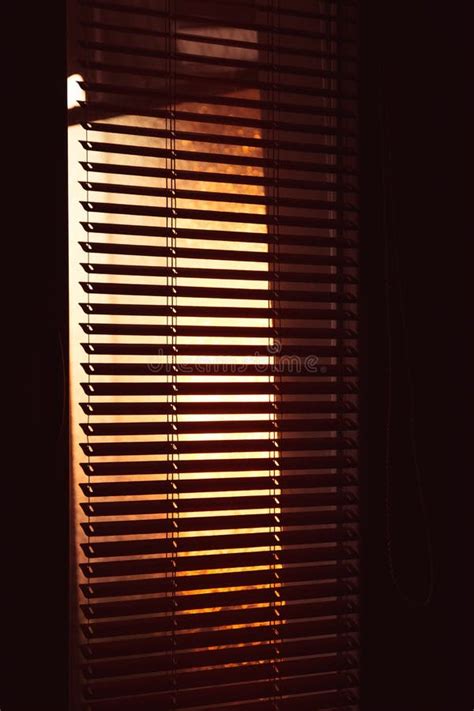 Sun Filtering Through Venetian Shades Indoor Golden Sunset Light