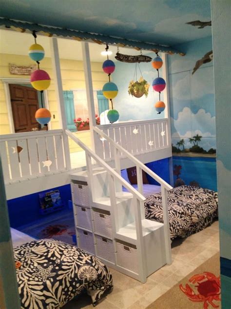 Use a net and clothespins to hang pictures. H o w C U T E! We had a custom bedroom beach shack built ...
