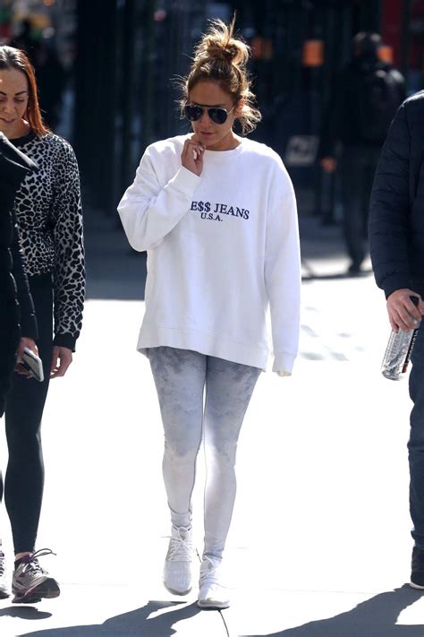 Jennifer Lopez Hits The Gym Wearing A White Guess Sweater And Grey