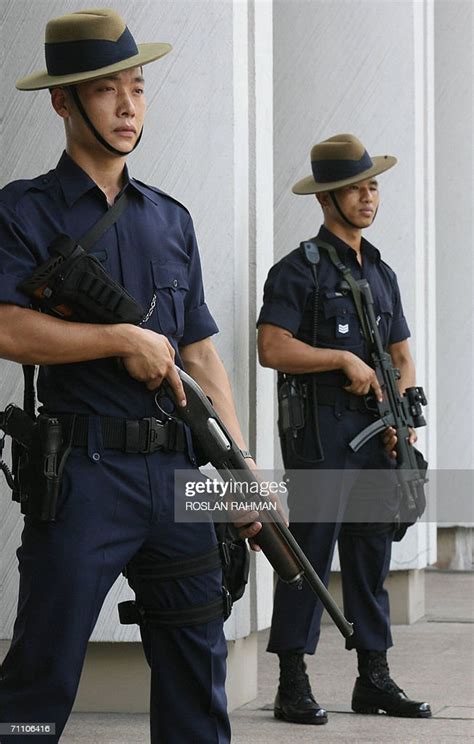 Two Armed Members Of The Gurkha Contingent Of The Singapore Police