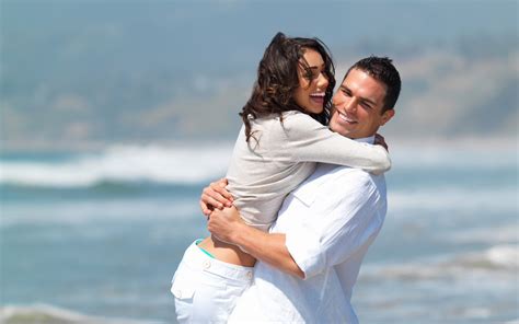Man And Woman Hugging Near Body Of Water During Daytime Hd Wallpaper