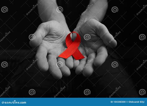 Aids Ribbon On Hands Hiv Stock Photo Image Of Closeup 104348300