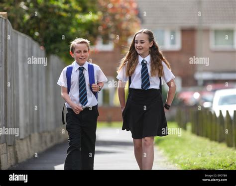 School Pupils In Uniform Walking To School Uk Stock Photo Alamy