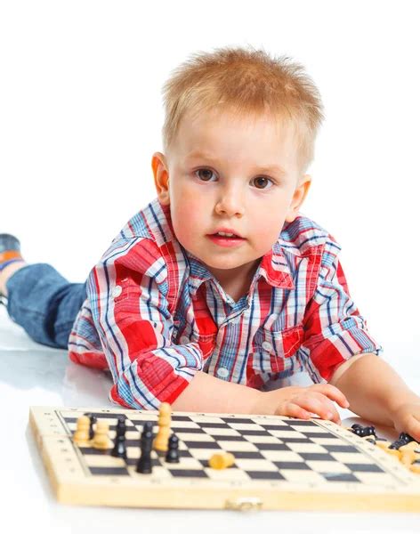 Little Boy Plays Chess Stock Photo By ©macsim 10197956