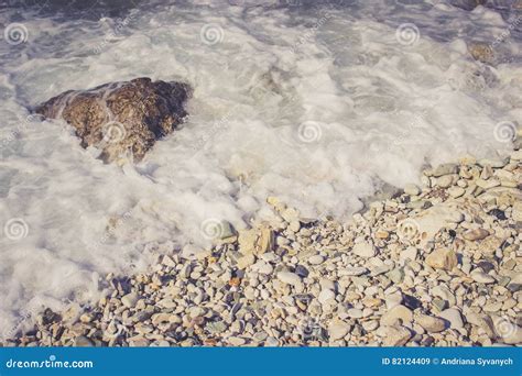 Foamy Wave Hits Pebble Rocks On The Beach Stock Image Image Of