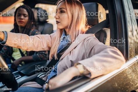 Young Women Driving In The Car Stock Photo Download Image Now