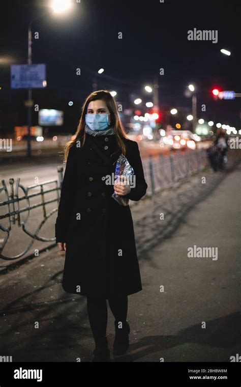 Young Woman Wearing Face Medical Mask Carrying Bread While Walking On