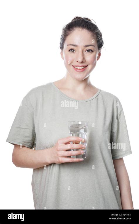 Cheerful Young Woman Holding Glass Of Water Stock Photo Alamy