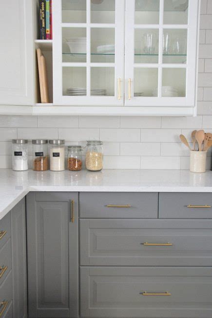 Glossy grey subway tiles arranged horizontally add traditional touch to your kitchen. Installing A Subway Tile Backsplash in Our Kitchen - the sweetest digs