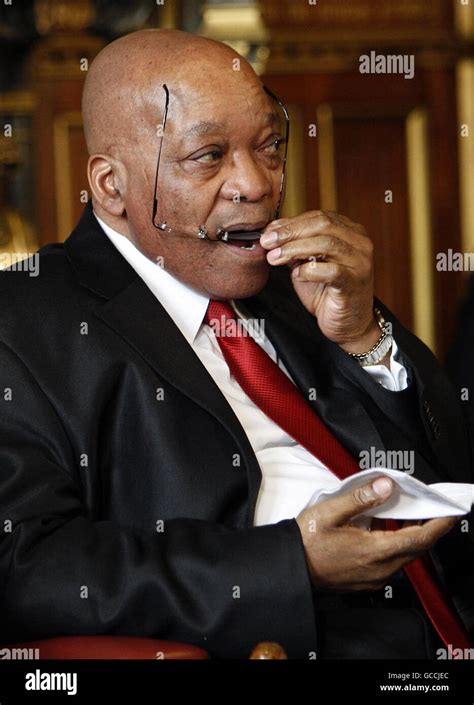 The President Of South Africa Jacob Zuma Cleans His Glasses Before