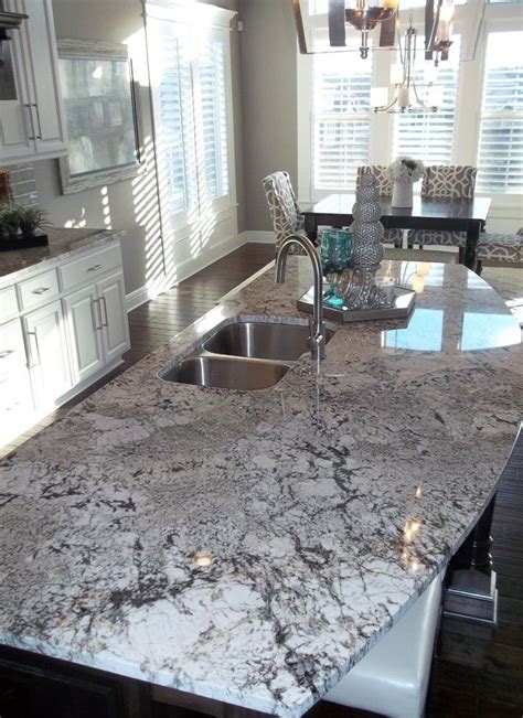 In addition, it can make your kitchen look a lot more airy and bright. exodus white granite countertop granite island white cabinet undermount sink stainless steel ...