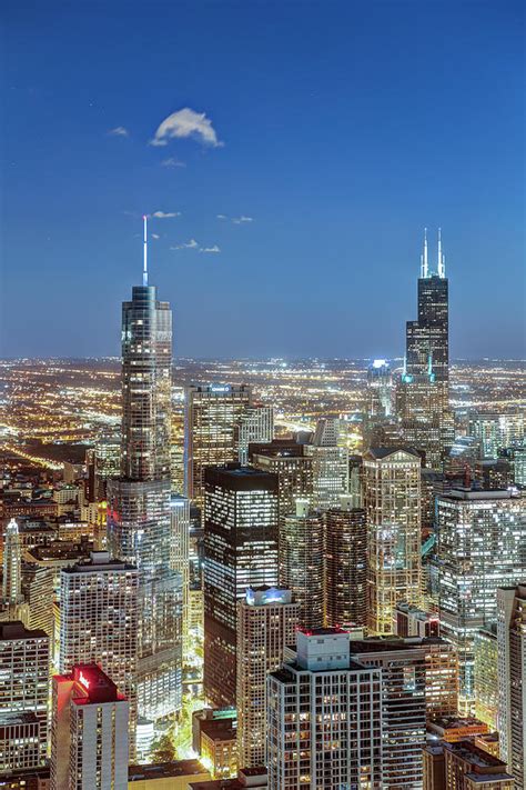 Chicago skyline along the river at dusk with wrigley building in the distance. Chicago Downtown City Skyline by Gavin Hellier