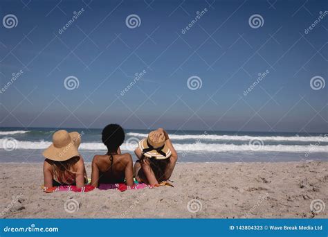 Beautiful Young Women Lying And Relaxing At Beach In The Sunshine Stock Image Image Of Adult